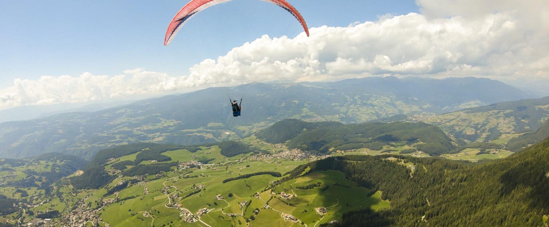 Paragliding with a view of the Alpe di Siusi & the western Dolomites