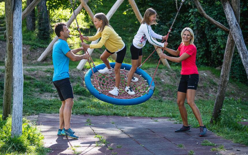 A family at the bird’s nest swing