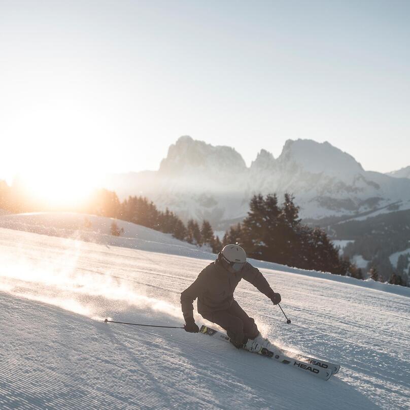 A man skis down a slope on the Seiser Alm
