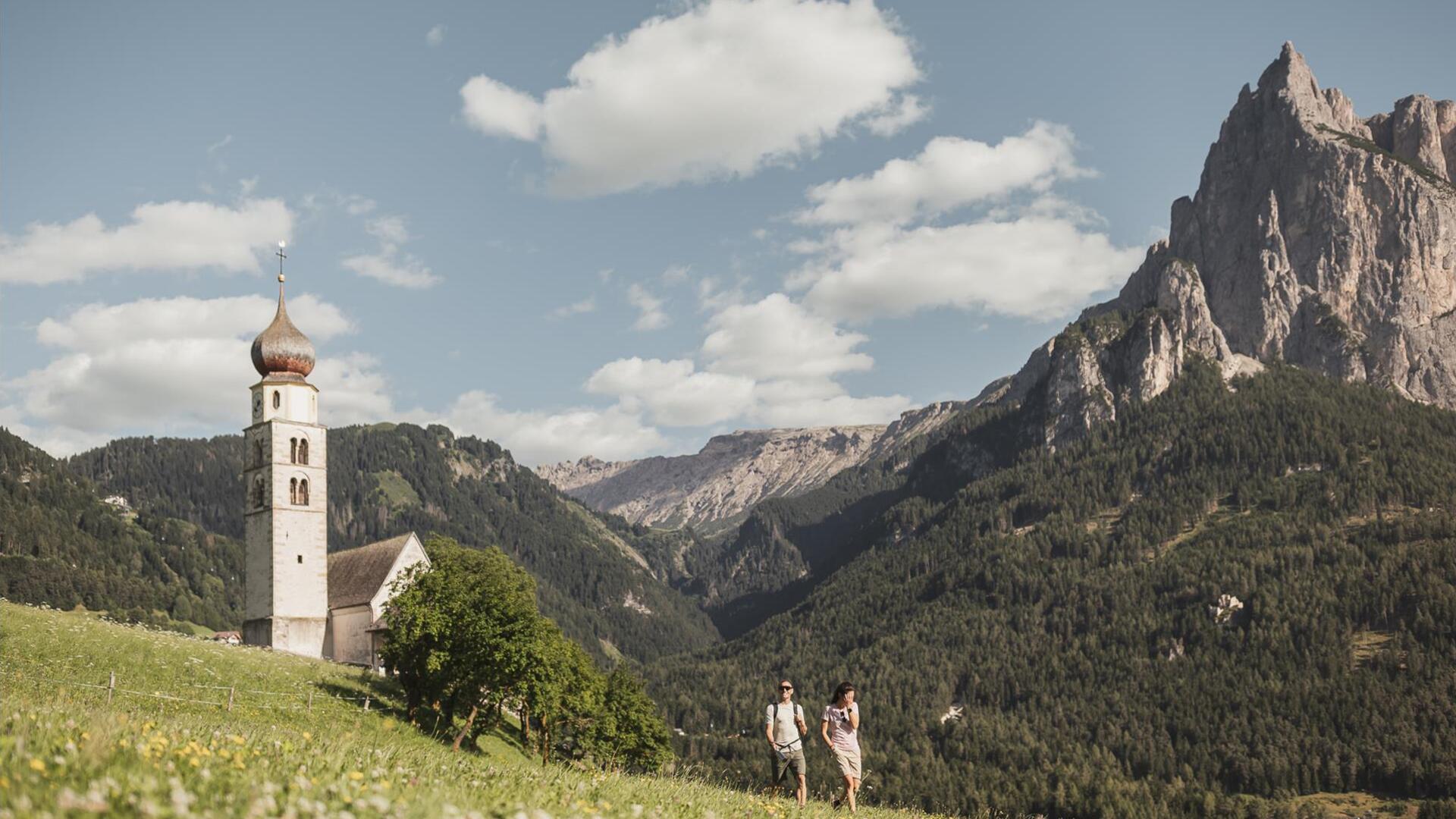 Parish church of Seis am Schlern, with the Dolomites in the background