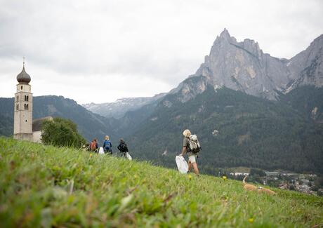 A group of people collect litter