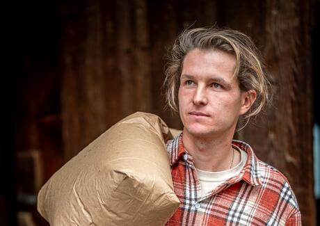 A man is smiling at the camera