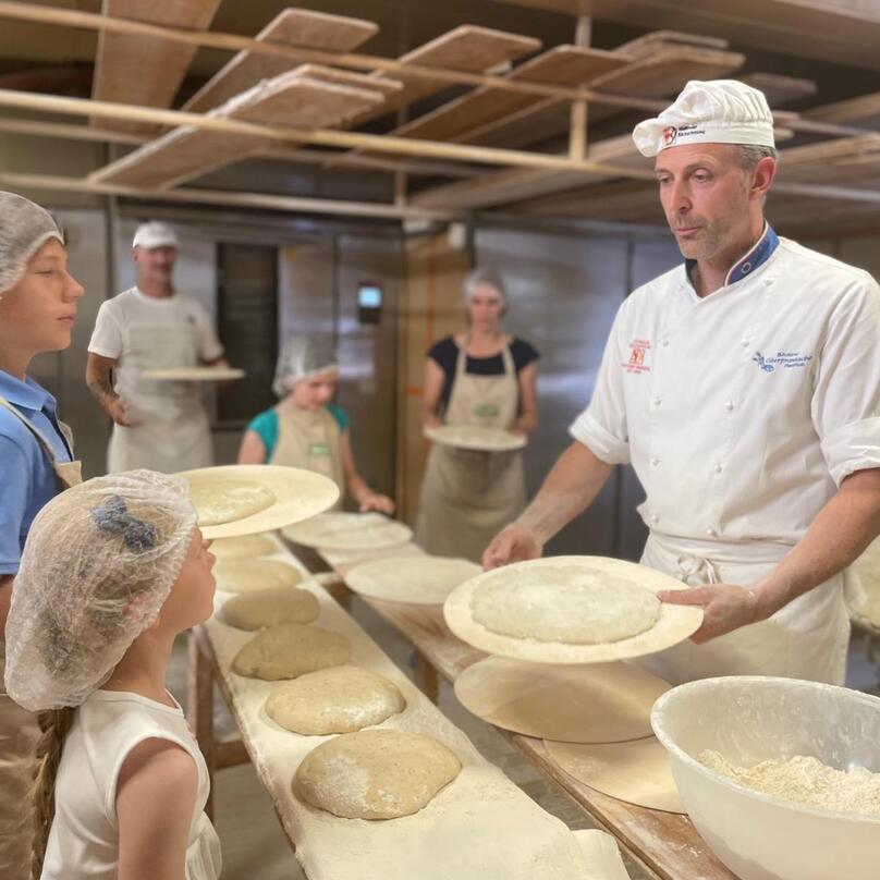 Children baking bread
