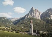 Parish church of Seis am Schlern, with the Dolomites in the background