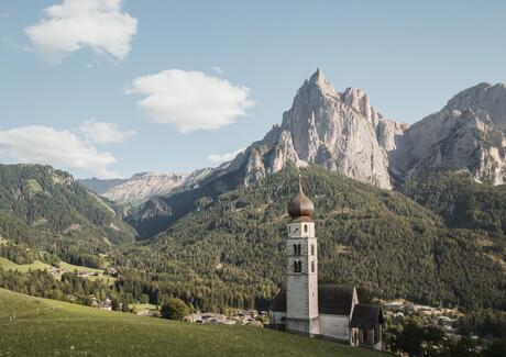 Parish church of Seis am Schlern, with the Dolomites in the background