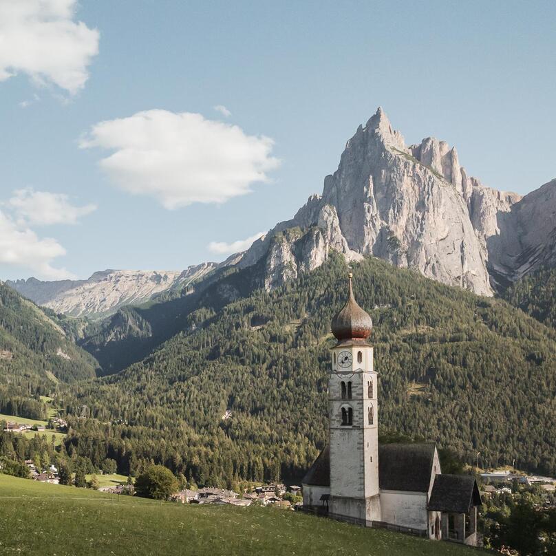Parish church of Seis am Schlern, with the Dolomites in the background