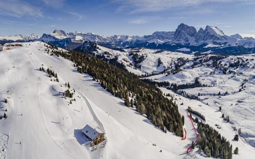 Dolomiti Superski Panorama View of the Alpe di Siusi ski slopes with the Dolomites in the background