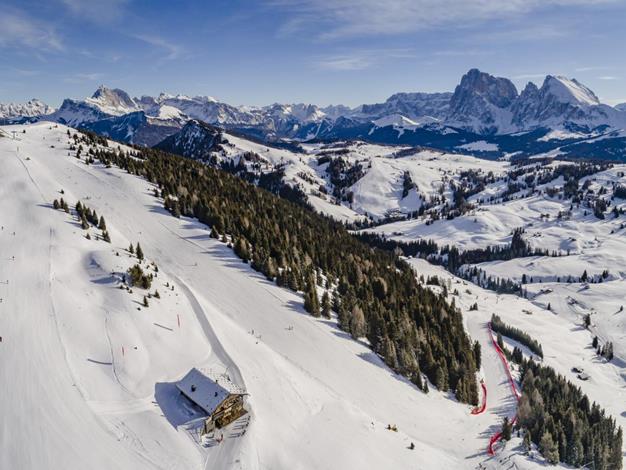 Dolomiti Superski Panorama View of the Alpe di Siusi ski slopes with the Dolomites in the background