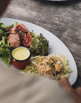 A person is eating dumplings