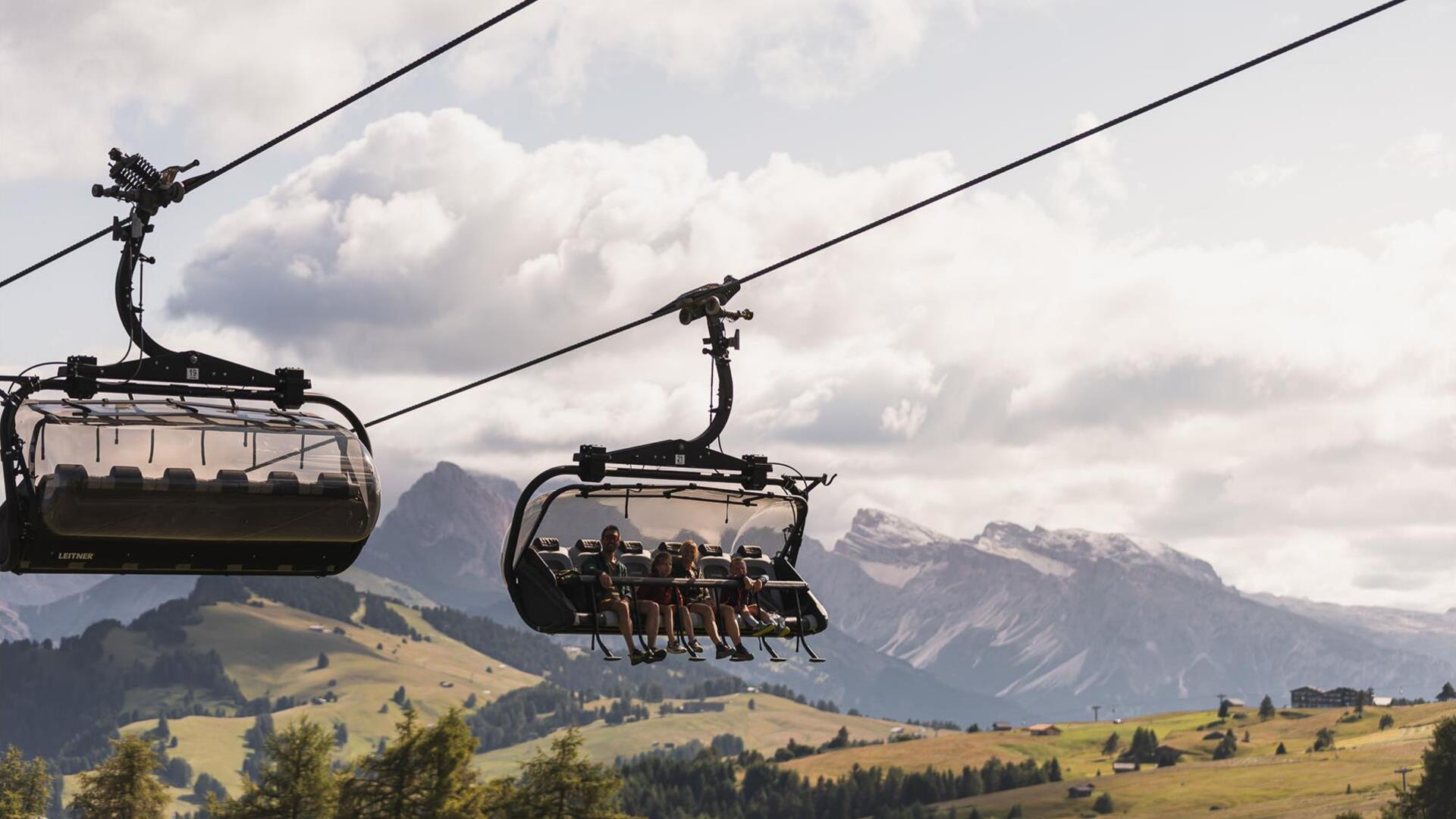 Four people on a chairlift