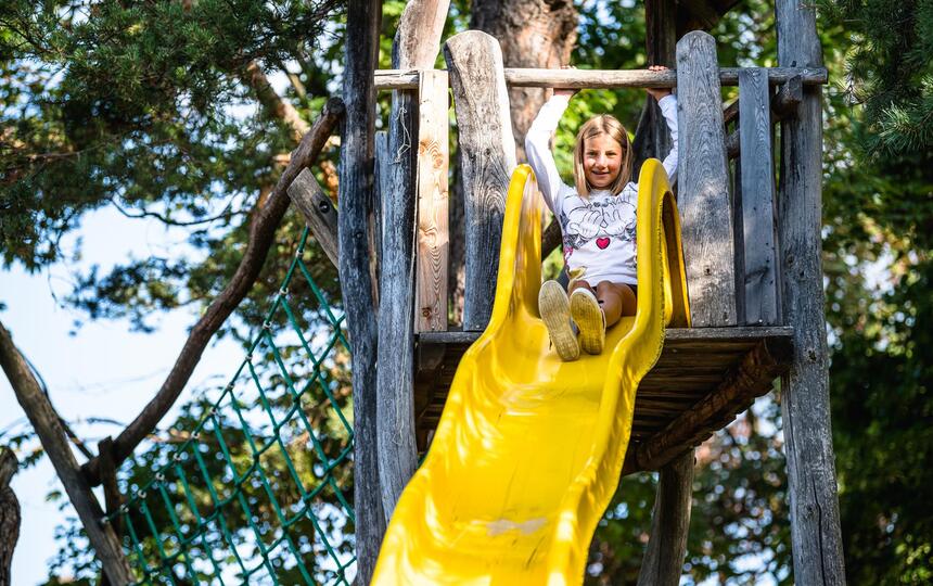 A child goes down a slide